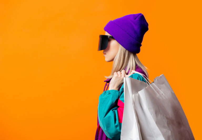 Woman carrying a shopping bag over her shoulder meant to represent Retail Market Research.